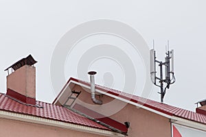 Telecommunication antenna on the roof, cellular and telephone communications.