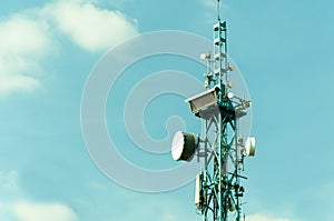 Telecommunication antennas outdoor on the tall metal pole construction.