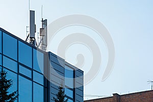 Telecommunication base stations on the roof of the building