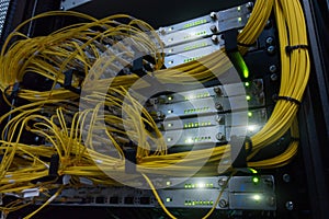 Telecommunication Broadband Fiber Optical Cables. Datacenter rack. Technology concept.