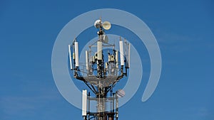 Telecommunication cellular tower against blue sky