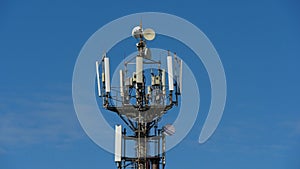 Telecommunication cellular tower against blue sky