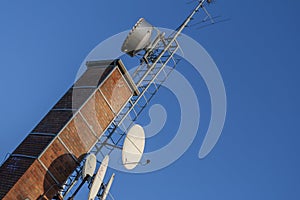 Telecommunication devices on a brick chimney