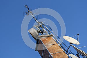 Telecommunication devices on a brick chimney