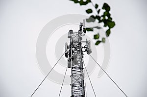 Telecommunication engineer working on high tower,Risk work of high work,Technician working with safety equipment on