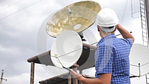 Telecommunication Internet connection concept industry production station concept. TV station worker man engineer