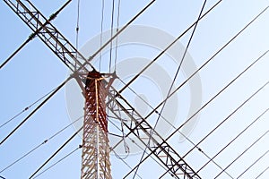 Telecommunication mast TV antennas with blue sky. High transmitter towe