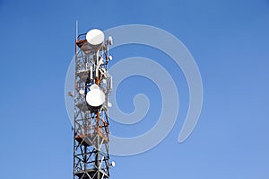 Telecommunication mast TV antennas wireless technology with blue sky in the morning