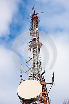Telecommunication mast TV antennas wireless technology with blue sky in the morning