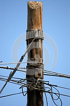 Telecommunication pole full of various cables
