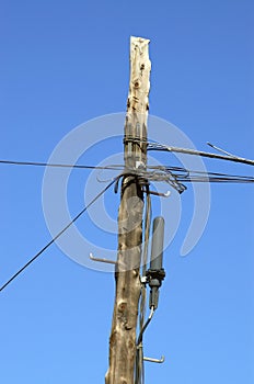 telecommunication pole with lots of cables