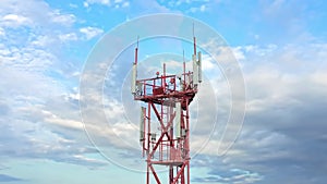 Telecommunication technology antennae on the telecom tower against blue sky