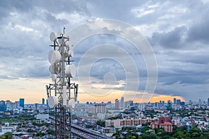 Telecommunication tower with 5G cellular network antenna on city background
