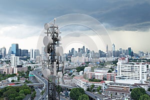 Telecommunication tower with 5G cellular network antenna on city background