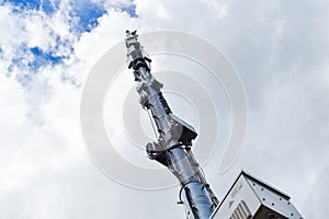 Telecommunication tower 5g, metal high mast with antennas.