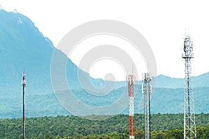 Telecommunication tower antenna with mountain background. Various of mobile telephone communication tower in forest background