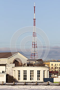 Telecommunication tower on blue sky background.