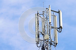 Telecommunication tower with blue sky background. Technology and communication