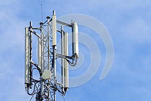 Telecommunication tower with blue sky background. Technology and communication