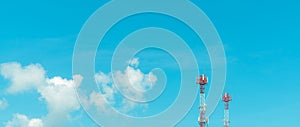 Telecommunication tower with blue sky and white clouds. Radio and satellite pole. Communication technology. Telecommunication
