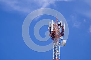 Telecommunication tower on bright blue sky and cloud background