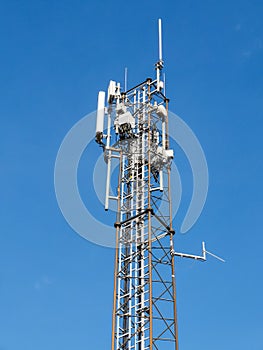 A telecommunication tower with different kinds of antennas on top