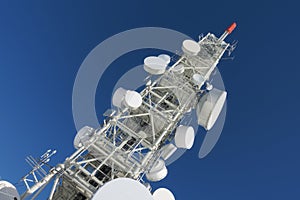 Telecommunication tower with dish antennas