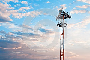 Telecommunication tower on   dramatic cloudy sky background