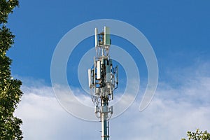 Telecommunication tower mast on sky background. Cellular telephone network or Digital wireless connection system. Receiving