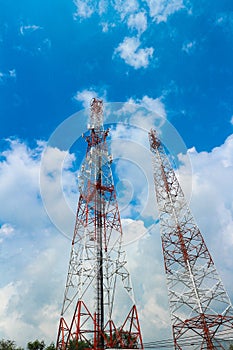 Telecommunication Tower. Mobile Phone Signal Tower on cloudy blue sky background