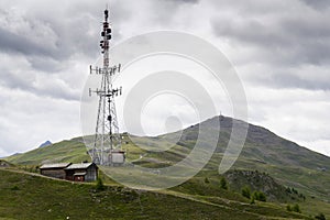 Telecommunication tower with Monte della Neve in background photo