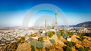 Telecommunication tower on mountin with 4G 5G cellular network antenna on city background. telecommunications mast TV