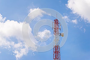 Telecommunication tower pole with cloud and blue sky background