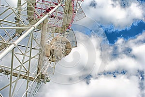 Telecommunication tower with a sunlight. Used to transmit television signals.