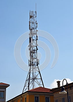 Telecommunication tower. Tower antennas and satellite transmitters for cellular mobile signals. Ravenna, Italy
