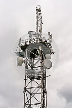 Telecommunication tower with transmitters antennas and parabolas