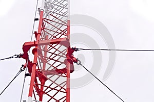 Telecommunication tower used to transmit television and 3g signals isolated on white photo