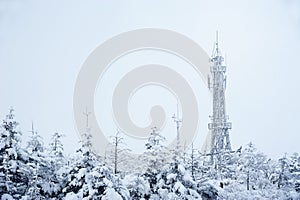 Telecommunication tower in winter photo