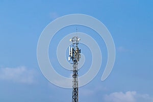 Telecommunication tower. Wireless Communication Antenna Transmitter with antennas bright sunlight and sky background