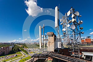 Telecommunication tower with wireless communications systems are including microwave, panel antennas