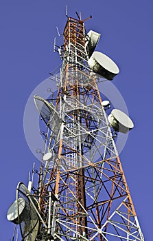 Telecommunication towers against blue sky