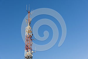 Telecommunication towers with blue sky in the background photo