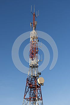 Telecommunication towers with blue sky in the background photo