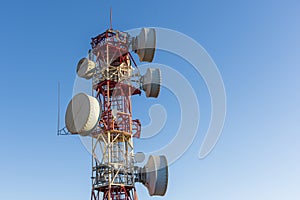 Telecommunication towers with blue sky in the background photo