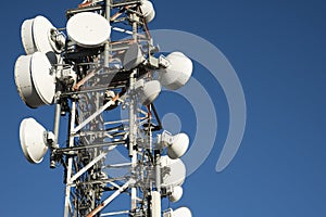 Telecommunication towers with blue sky in the background photo