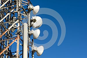 Telecommunication towers with blue sky in the background photo