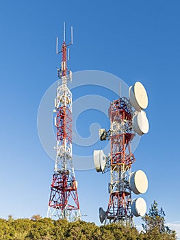 Telecommunication towers with blue sky in the background photo