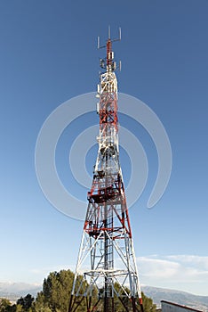 Telecommunication towers with blue sky in the background photo