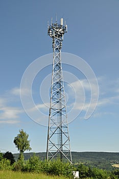 Telecommunication towers on a green hill