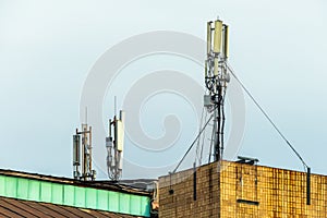 Telecommunication towers of mobile communication and Internet, antennas on the roof of a building